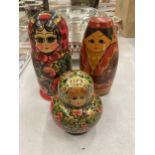 A GROUP OF THREE RUSSIAN LACQUERED DOLLS