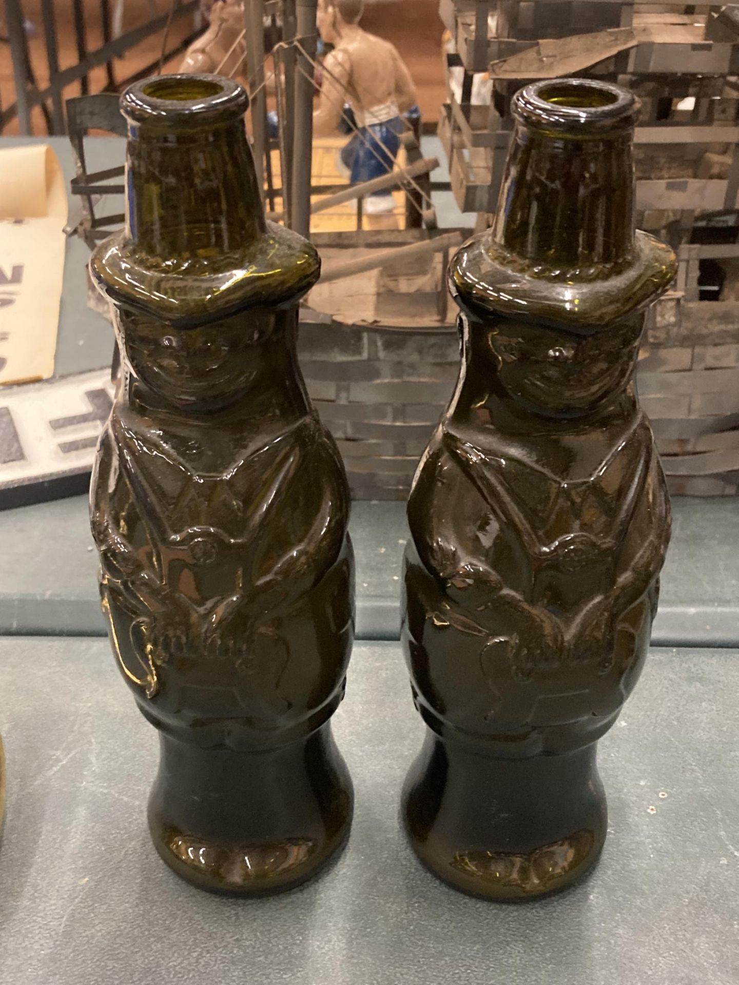 A PAIR OF VINTAGE GERMAN BEER BOTTLES IN THE SHAPE OF TYROLIAN MEN