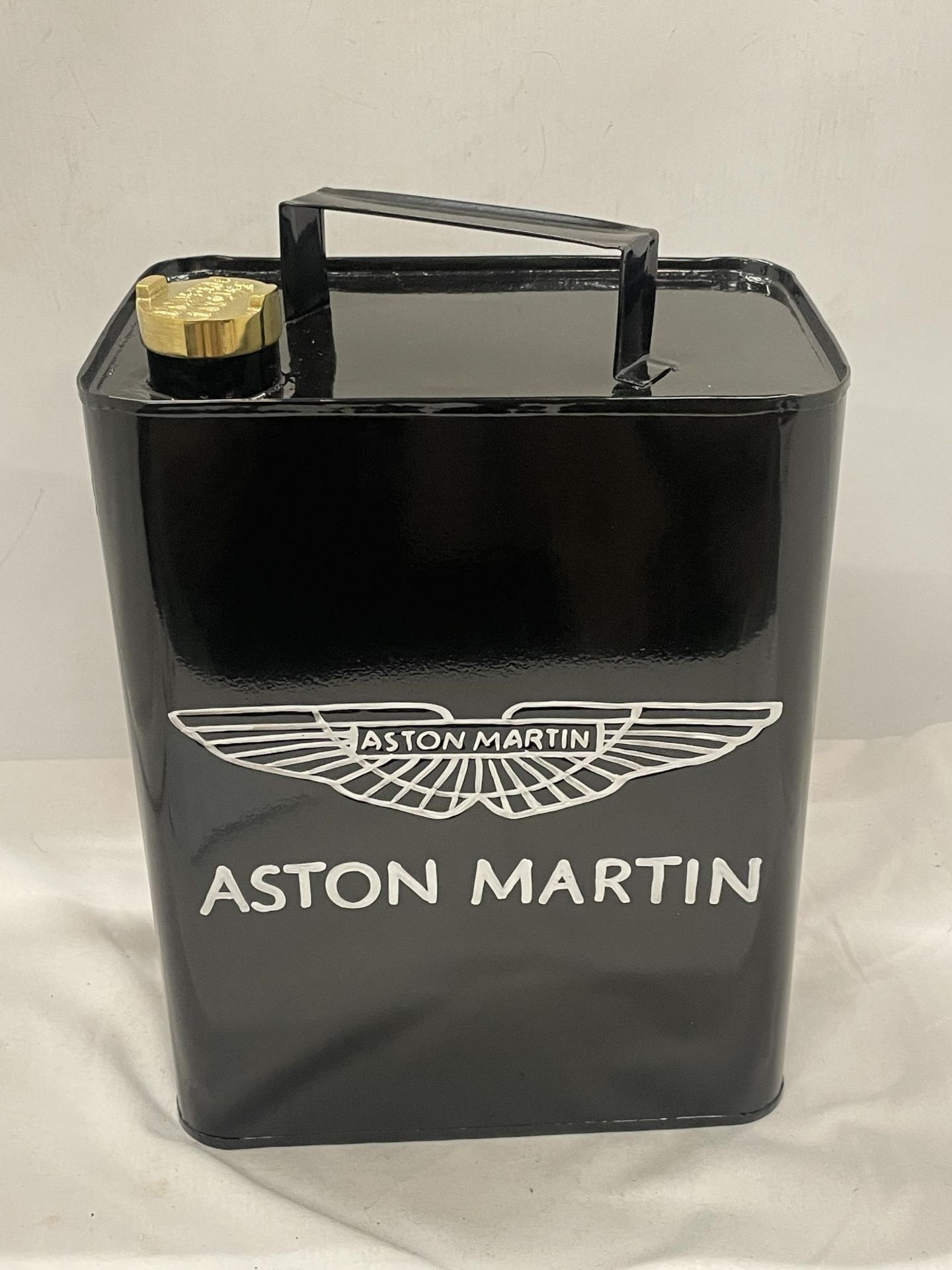 A BLACK ASTON MARTIN PETROL CAN