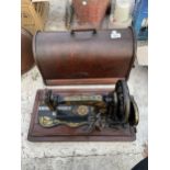 AN UNUSUAL AND VINTAGE SINGER SEWING MACHINE WITH WOODEN CARRY CASE