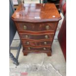 A REPRODUCTION SERPENTINE FRONTED SYDNEY SMITH CHEST OF FOUR DRAWERS, 16" WIDE