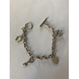 A SILVER T-BAR CHARM BRACELET