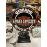 A LARGE CONVEX STEEL HARLEY DAVIDSON MOTOR OIL SIGN ON PEDESTAL, 21" HIGH