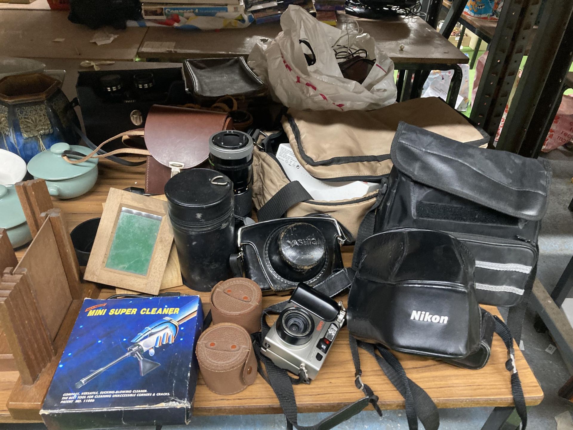 A LARGE QUANTITY OF VINTAGE CAMERAS AND ACCESSORIES TO INCLUDE YASHICA, NIKON AF, OLYMPUS, LENSES, 4