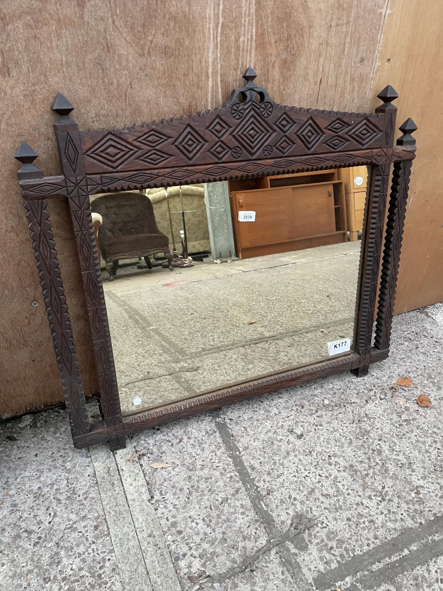 A HEAVILY CARVED OAK VICTORIAN WALL MIRROR, 36 X 32"