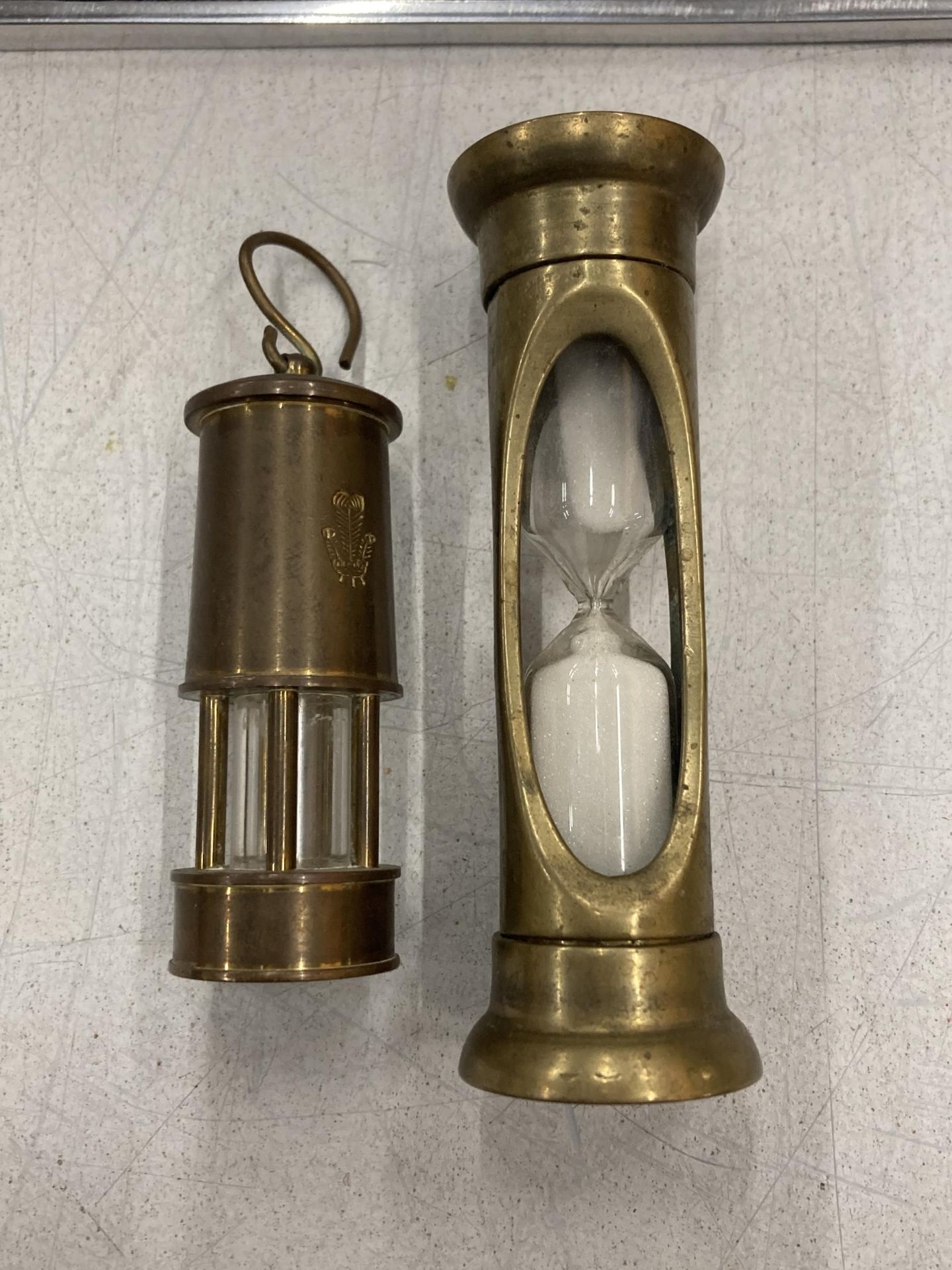 TWO VINTAGE BRASS ITEMS - SMALL MINERS LAMP AND SAND TIMER