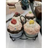 FOUR POTTERY CUP CAKES AND STAND