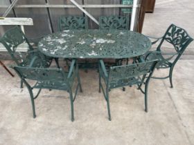 A LARGE VICTORIAN STYLE CAST ALLOY PATIO SET COMPRISING OF AN OVAL TABLE AND SIX CARVER CHAIRS