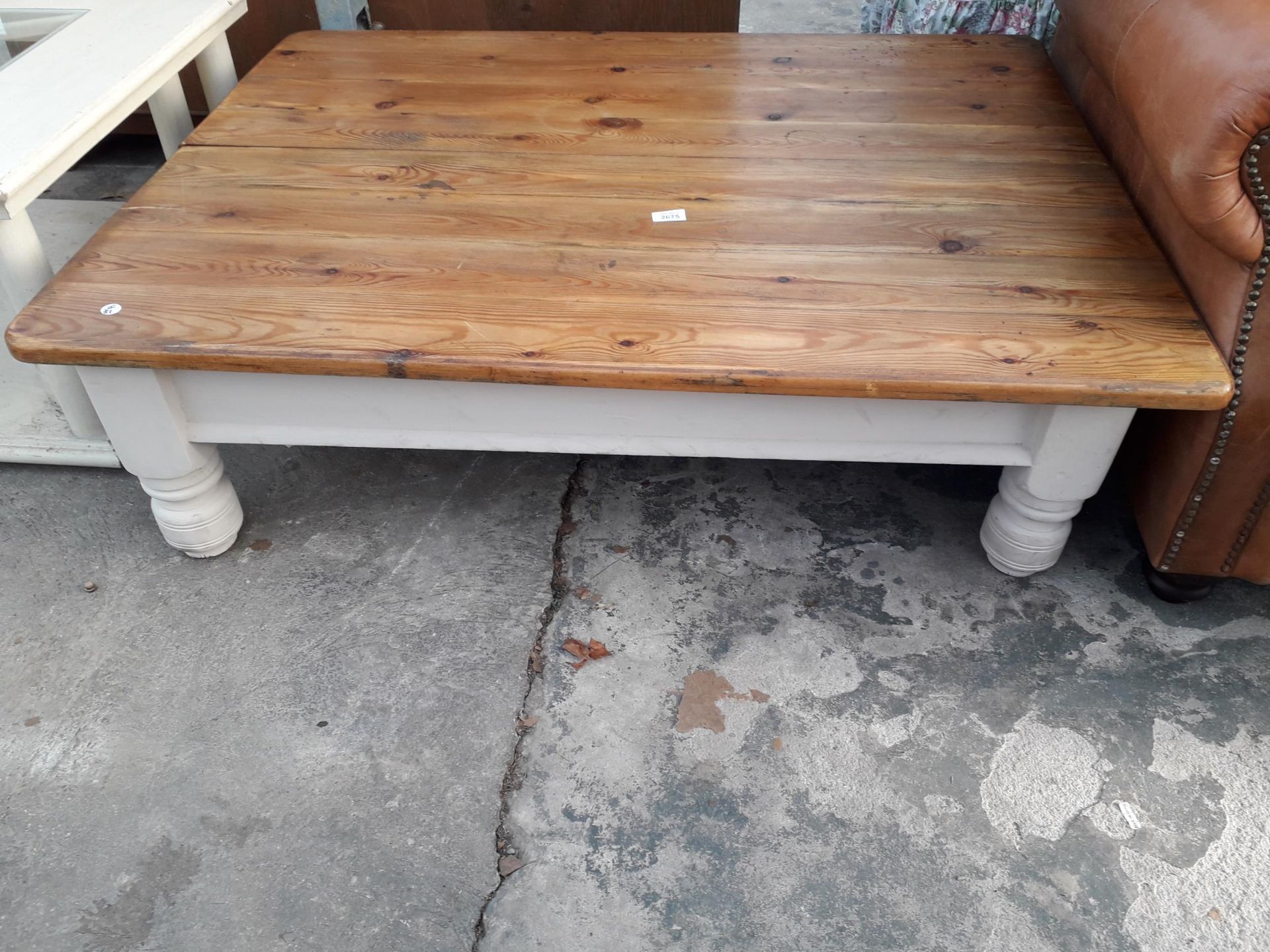A MODERN PINE COFFEE TABLE ON PAINTED BASE, 48 X 36"