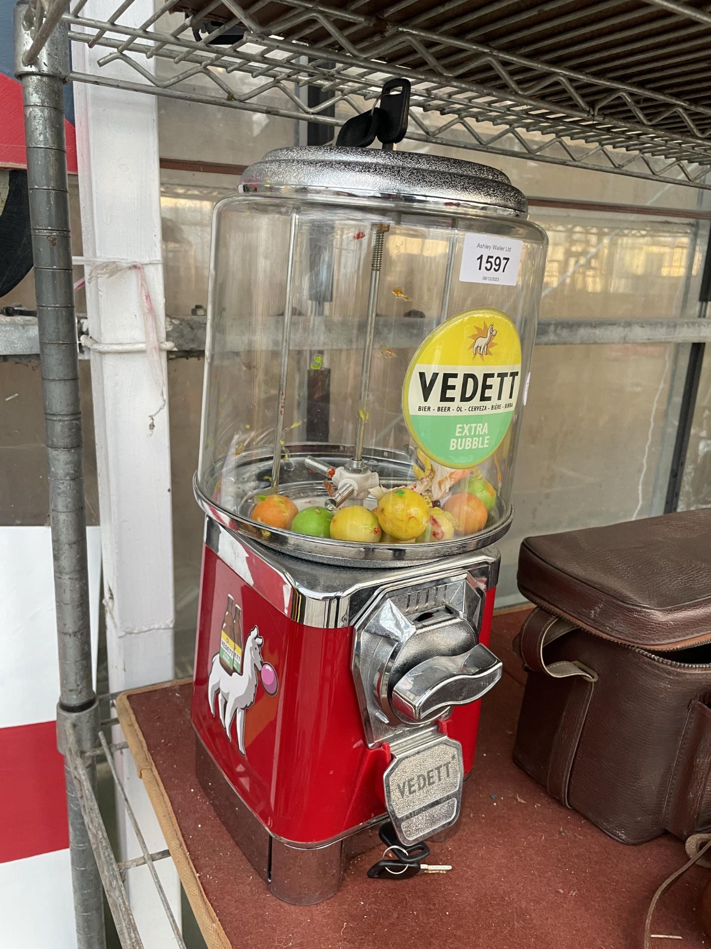 A VEDETT GOB STOPPER MACHINE WITH TOKENS AND KETYS ETC