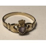 A 9 CARAT GOLD CLADDAGH RING WITH AN AMETHYST SIZE N/O