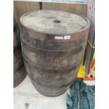 A VINTAGE OAK AND METAL BANDED BARREL