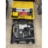 AN AS NEW AND BOXED MCKELLER SDS DRILL AND A LASER LEVEL KIT