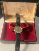 A VINTAGE LONGINES GENTLEMAN'S WRIST WATCH WITH 9 CARAT GOLD CASE, SILVERISED DIAL AND ORIGINAL CASE