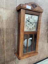 AN EARLY 20TH CENTURY BEECH EIGHT-DAY WALL CLOCK