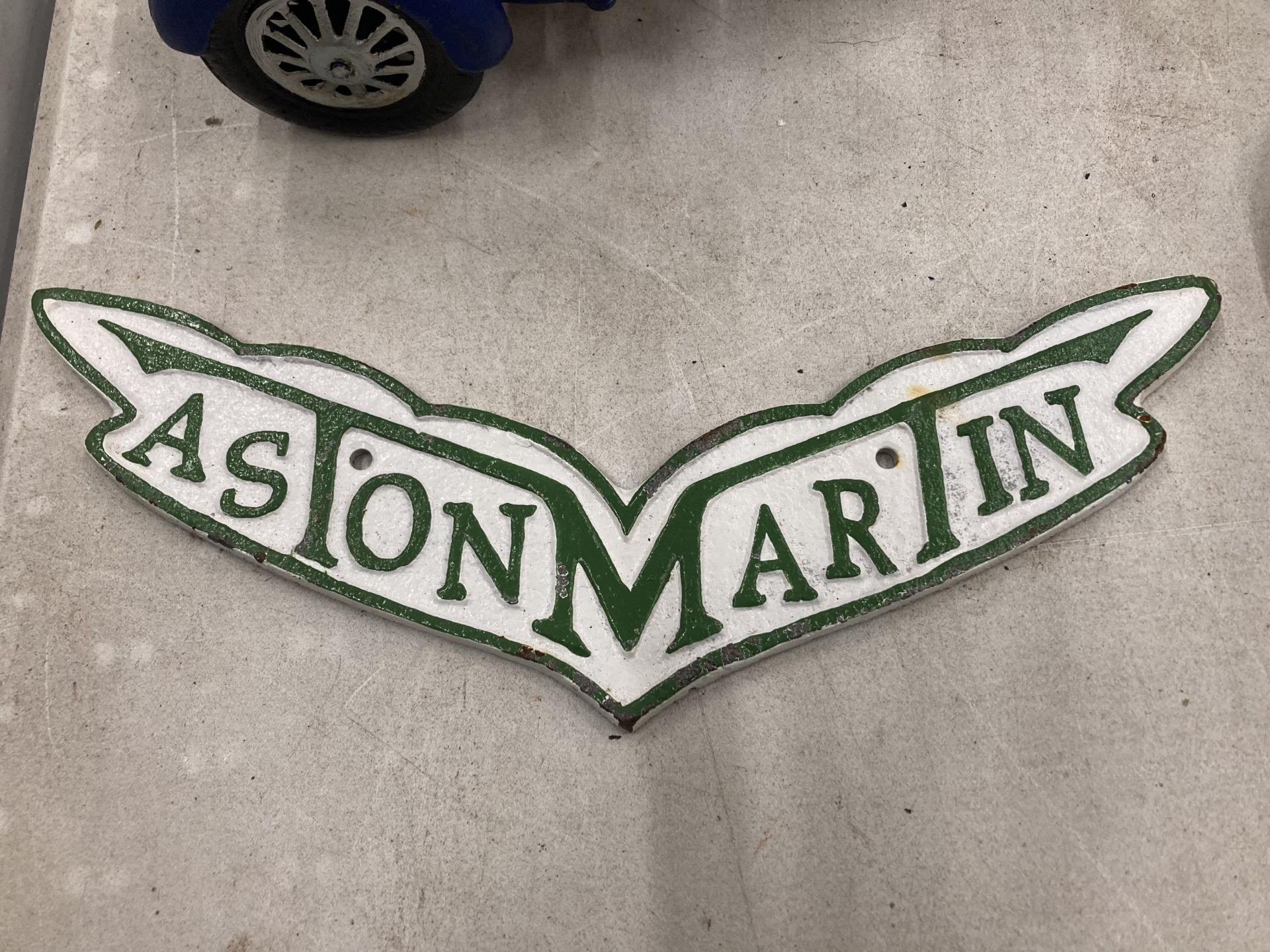 A CAST METAL ASTON MARTIN SIGN