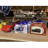 A QUANTITY OF BOXED DIE-CAST ADVERTISING VANS AND BUSES