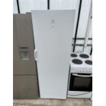 A TALL WHITE INDESIT UPRIGHT FRIDGE