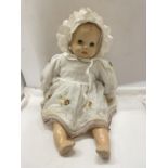 A LARGE VINTAGE DOLL WITH SLEEPY EYES