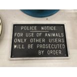 A CAST POLICE NOTICE SIGN