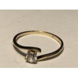 A 9 CARAT GOLD RING WITH A SOLITAIRE CUBIC ZIRCONIA SIZE J/K