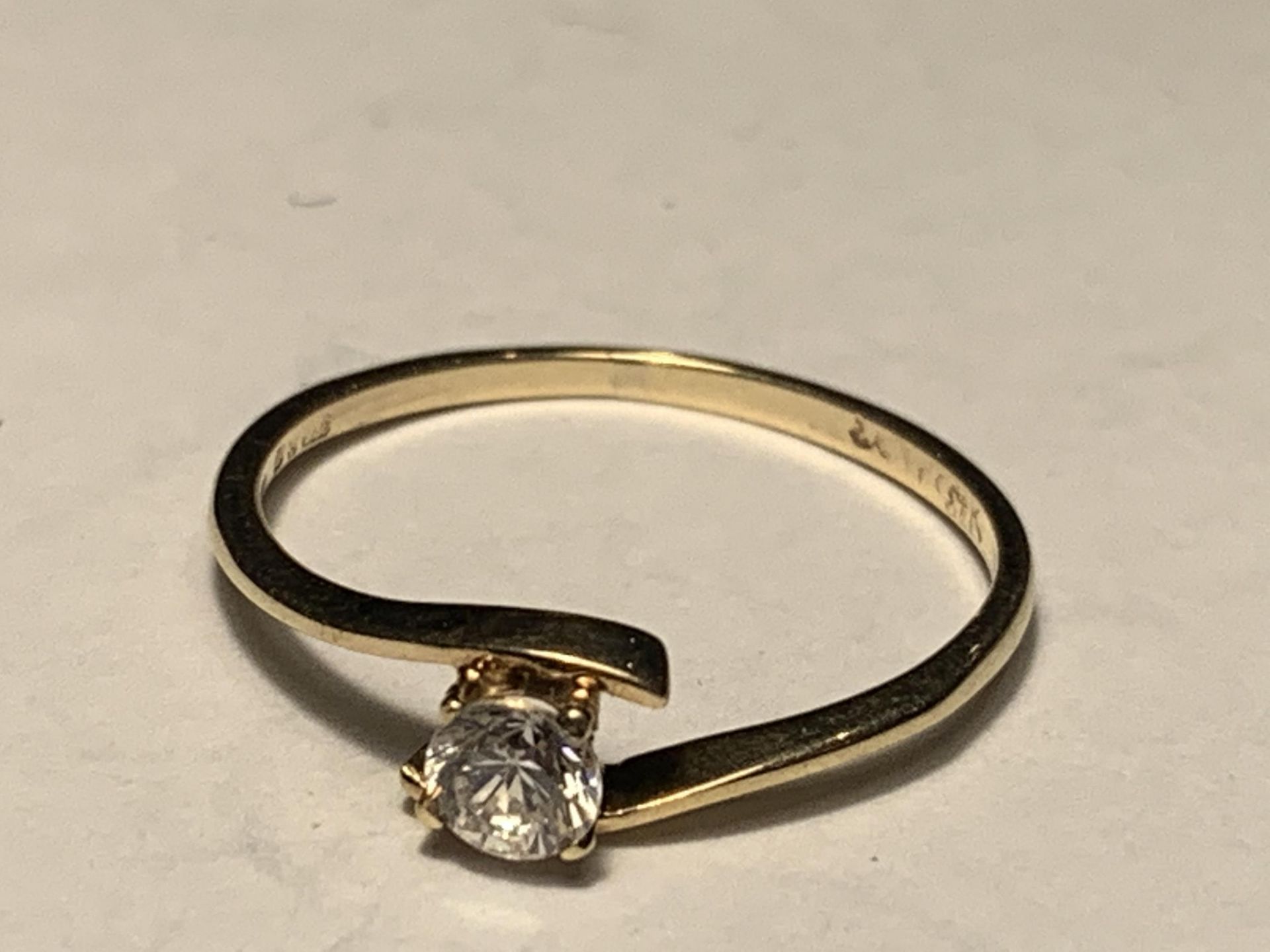 A 9 CARAT GOLD RING WITH A SOLITAIRE CUBIC ZIRCONIA SIZE J/K