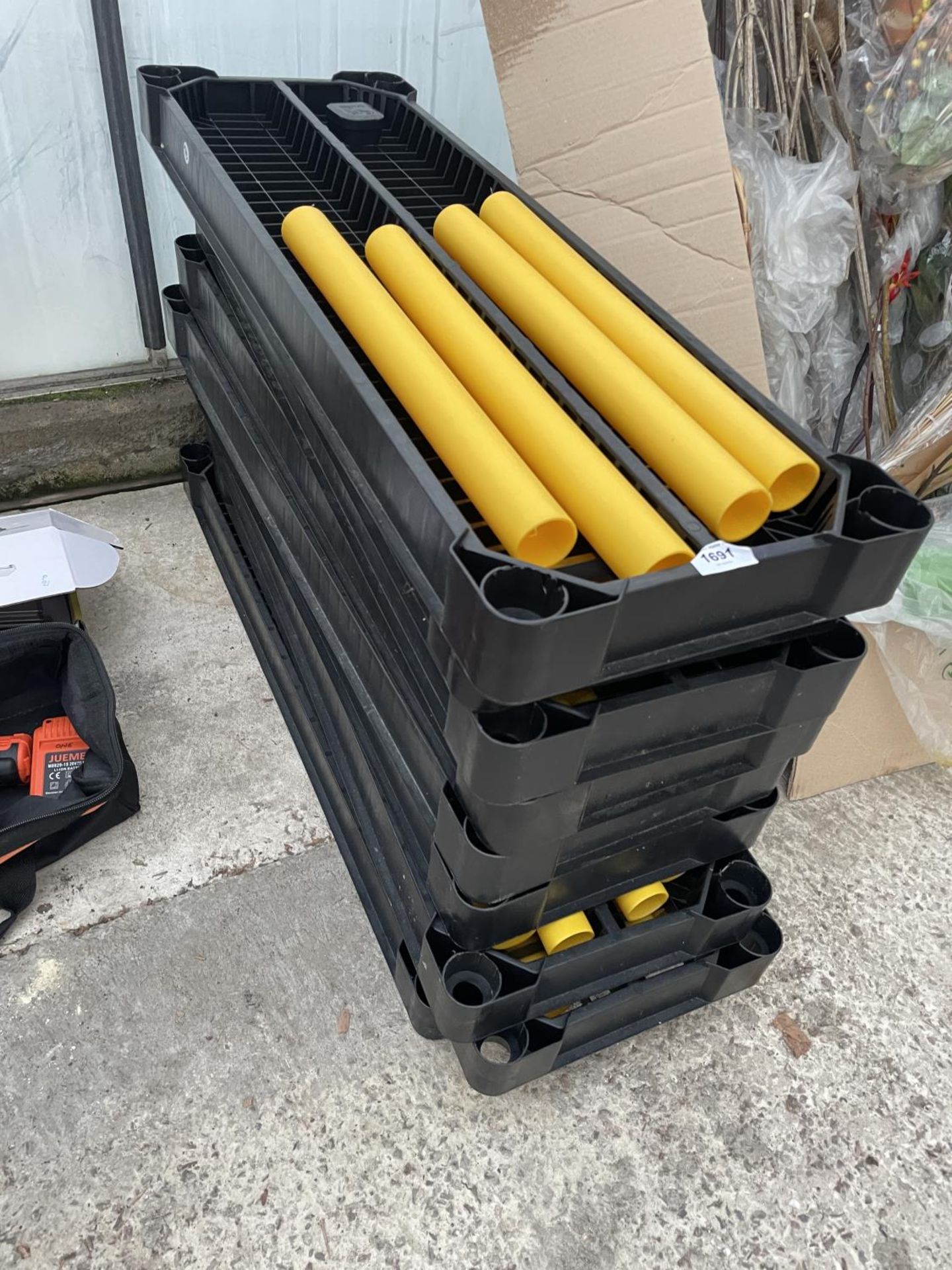 A PLASTIC WORKSHOP SHELVING UNIT