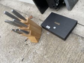 A JEAN PATRIQUE KNIFE SET AND A SHARPAL KNIFE SHARPENING SET