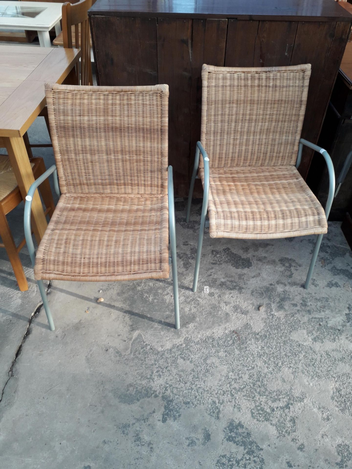 A PAIR OF MODERN TUBULAR METAL AND WICKER ARMCHAIRS