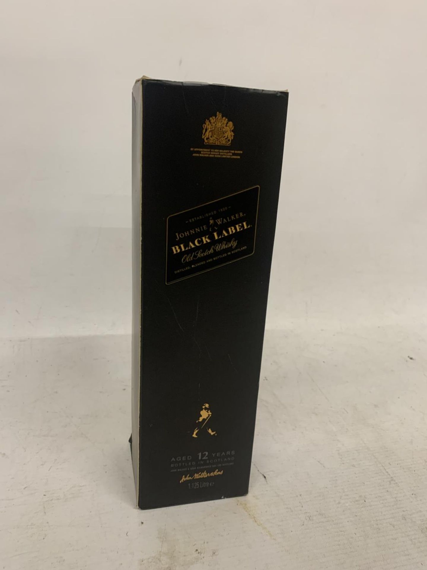 A 1.125L BOTTLE OF JOHNNIE WALKER BLACK LABEL 12 YEAR OLD SCOTCH WHISKY - BOXED
