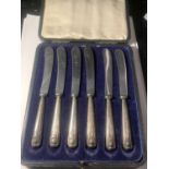 A BOXED SET OF HARRISON FISHER AND CO HALLMARKED SHEFFIELD HANDLE BUTTER KNIVES