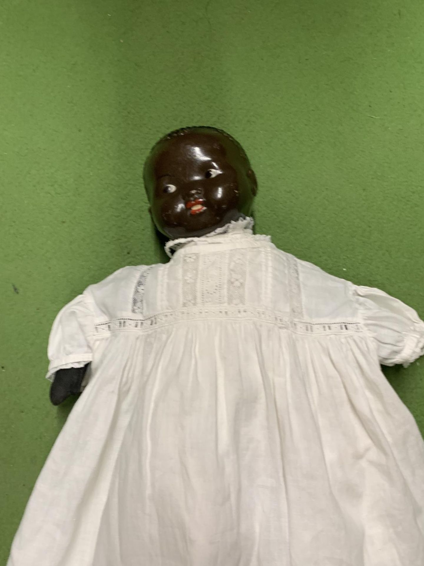 A VINTAGE DOLL WITH A CLOTH BODY, HARD PLASTIC HEAD AND ROSEBUD LIPS, MARKED TO THE BACK OF THE HEAD - Image 2 of 2
