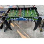 A CHILDS TABLE FOOTBALL AND TWO SCOOTERS