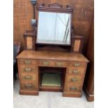 A VICTORIAN WALNUT KNEEHOLE DRESSING TABLE ENCLOSING NINE DRAWERS, TWO GLAZED CUPBOARDS AND