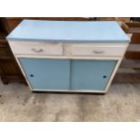 A 1950'S FORMICA TOP KITCHEN SIDEBOARD ENCLOSING TWO DRAWERS AND TWO SLIDING DOORS, 42" WIDE