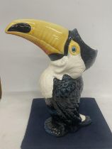 A DRAGONFLY JACK GRAHAM DESIGN TOUCAN FIGURE