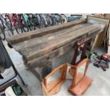 A LARGE VINTAGE WOODEN WORK BENCH