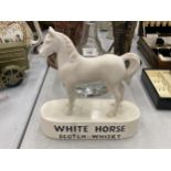 A VINTAGE KELSBORO WARE CERAMIC WHITE HORSE WHISKY ADVERTISING FIGURE