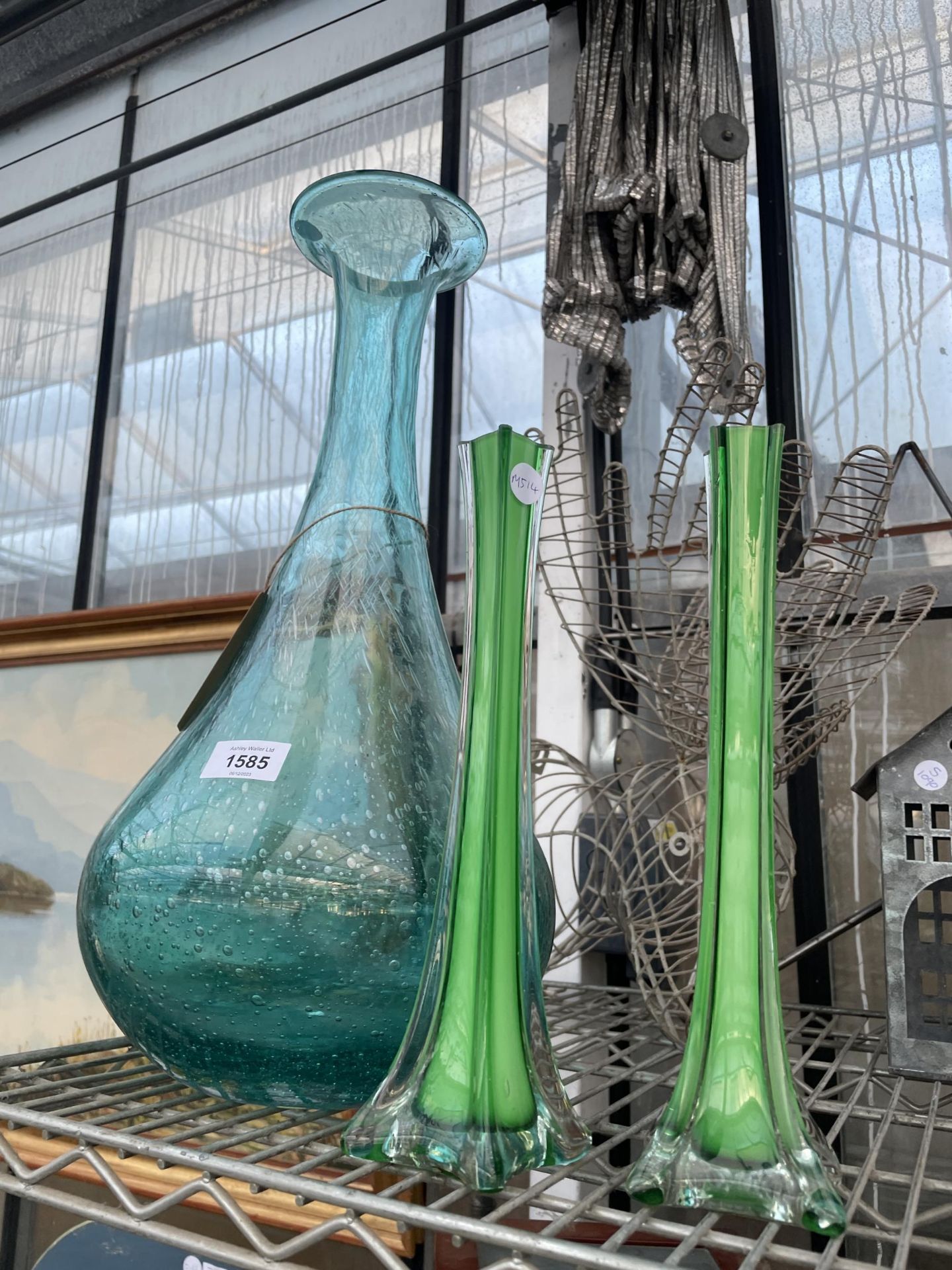 A LARGE GLASS VASE AND A PAIR OF SMALL GREEN VASES