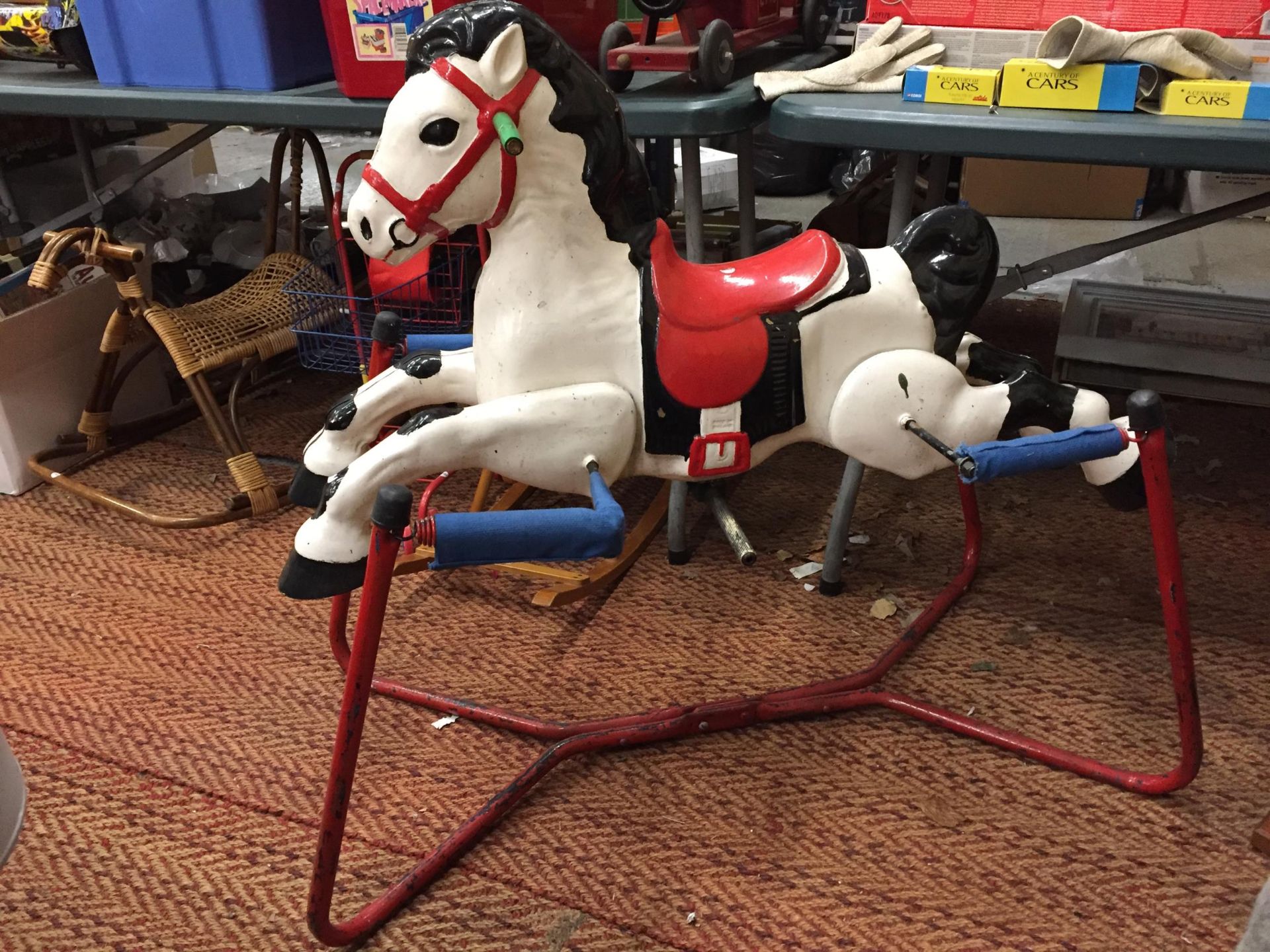 A VINTAGE METAL SPRING ROCKING HORSE