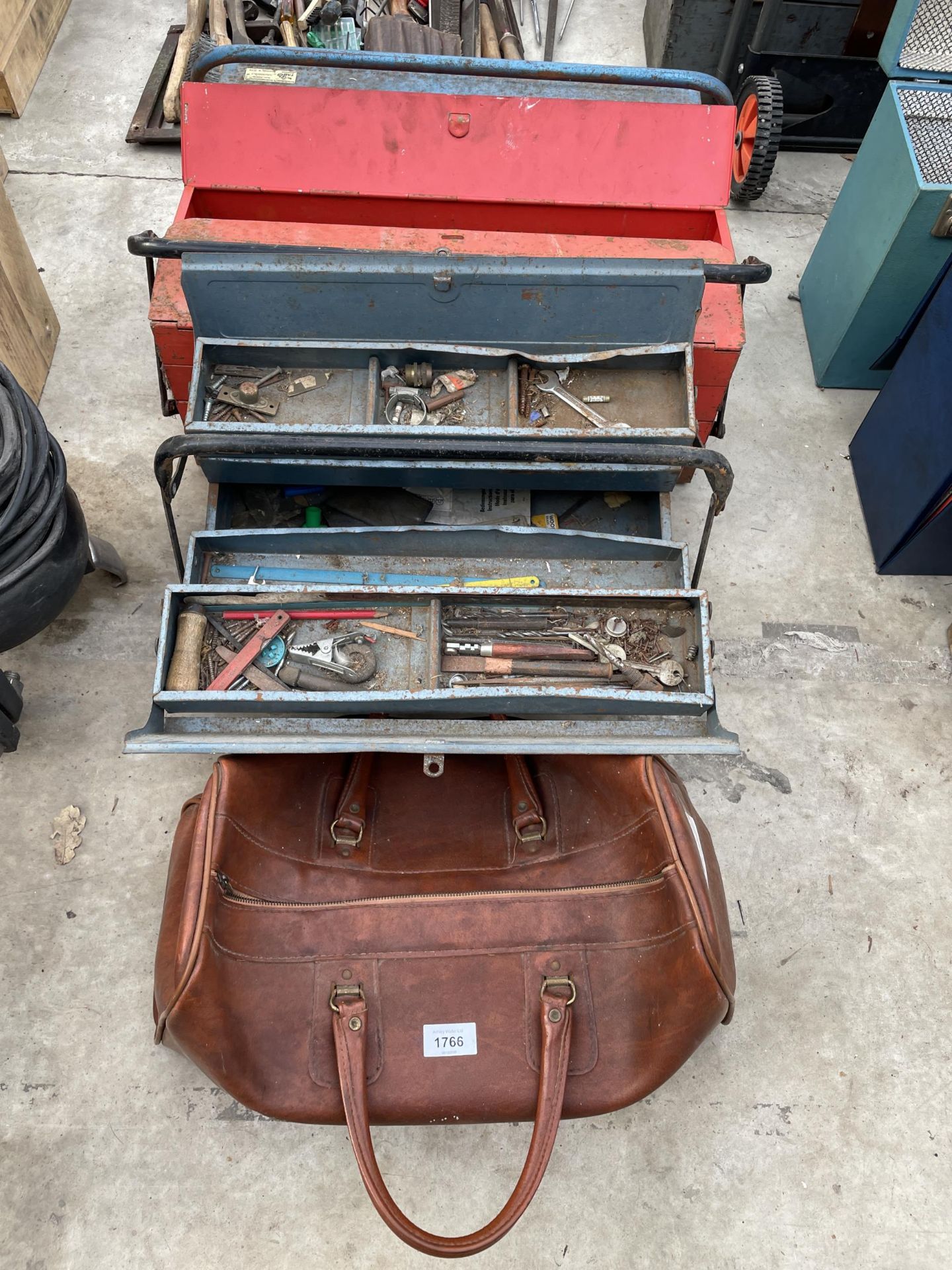 THREE METAL TOOL BOXES AND A LEATHER BAG WITH AN ASSORTMENT OF TOOLS TO INCLUDE PLIERS AND TROWELS