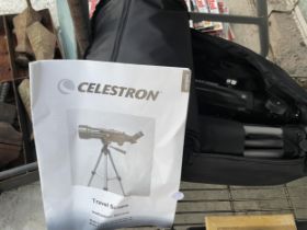 A CELESTRON TRAVEL TELESCOPE WITH CARRY BAG AND MANUAL