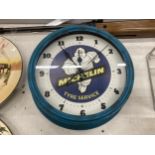 A MICHELIN MAN WALL CLOCK