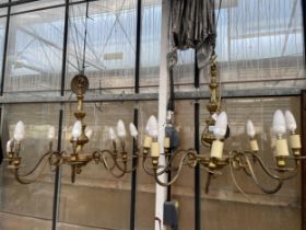 A PAIR OF EIGHT BRANCH BRASS CEILING LIGHT CHANDELIERS