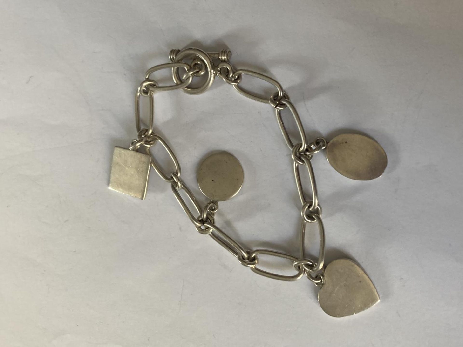 FOUR ASSORTED SILVER BRACELETS