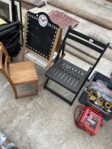 A FOLDING WOODEN CHAIR, A CHILDS CHALK BOARD AND A CHILDS CHAIRS