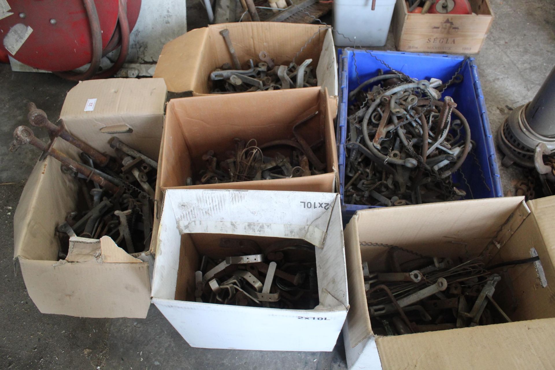 SIX BOXES OF ASSORTED METAL BRACKETS, HINGES AND BOLTS ETC