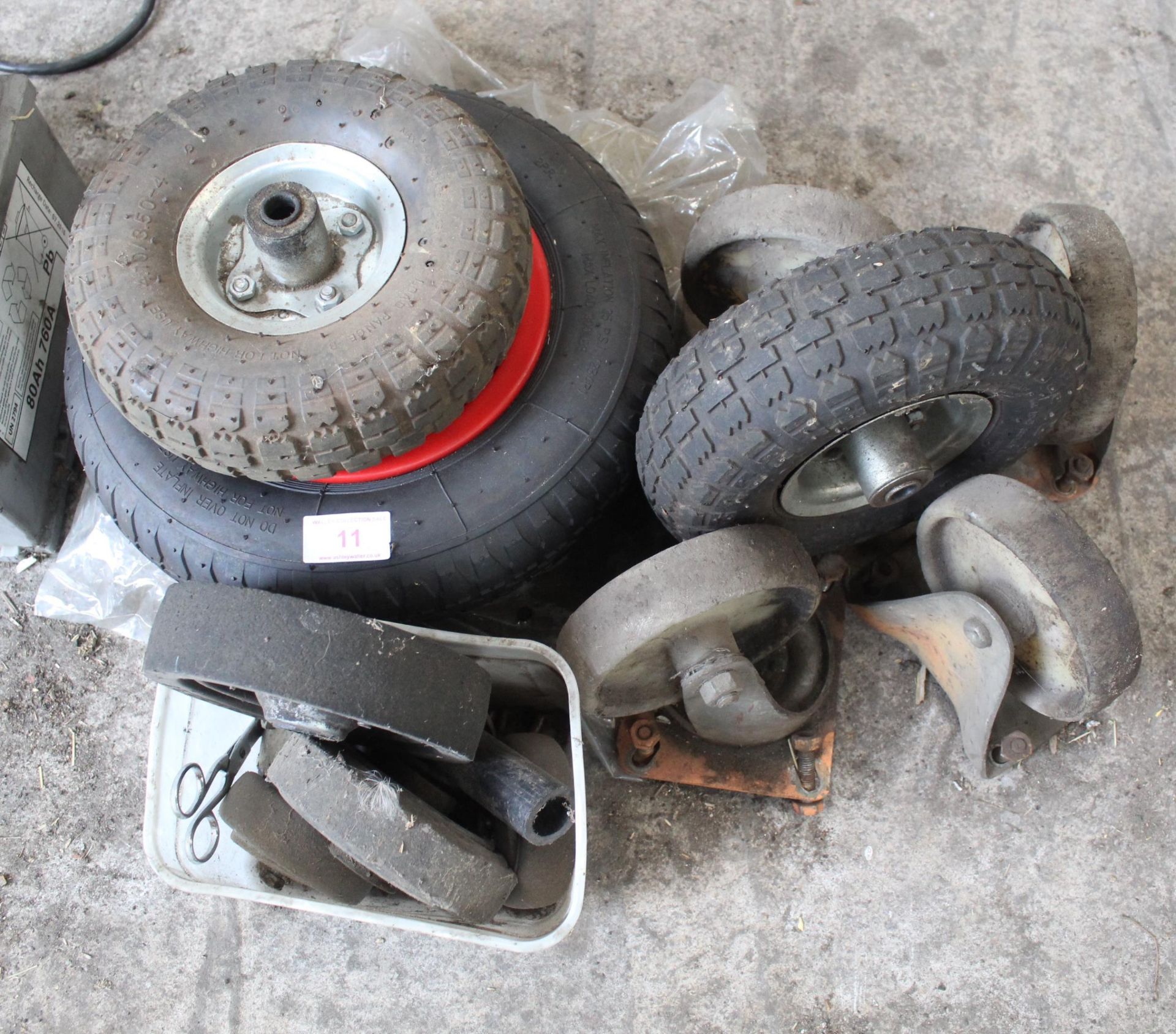 AN ASSORTMENT OF WHEELS TO INCLUDE TWO AS NEW WHEEL BARROW TYRES ETC