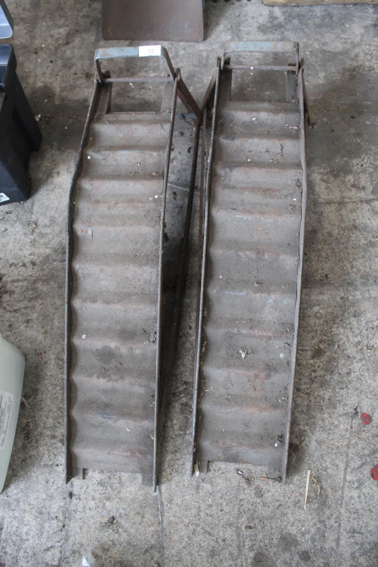 A PAIR OF METAL CAR RAMPS