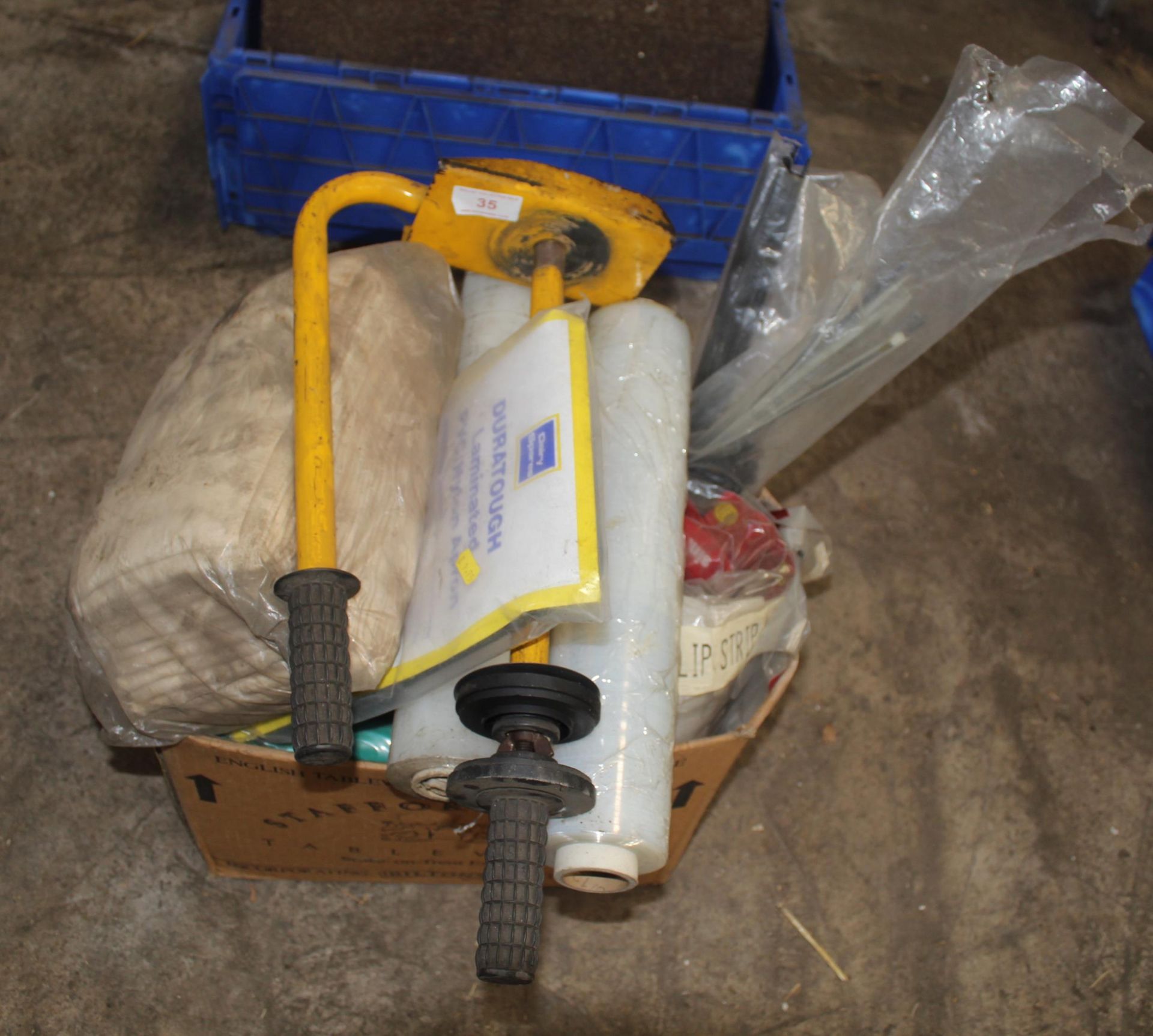 AN ASSORTMENT OF ITEMS TO INCLUDE A WHEEL LOCK, CABLE TIES AND SHRINK WRAP ETC